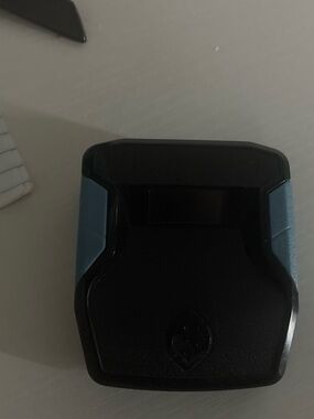 Compact Black and Teal Electronic Accessory